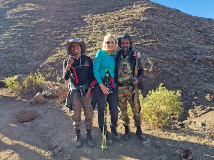 Tour guide relaxes on mountain in Ethiopia