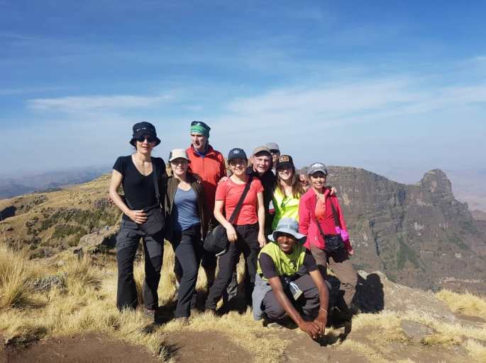 Climbing mountain group of people in Ethiopia